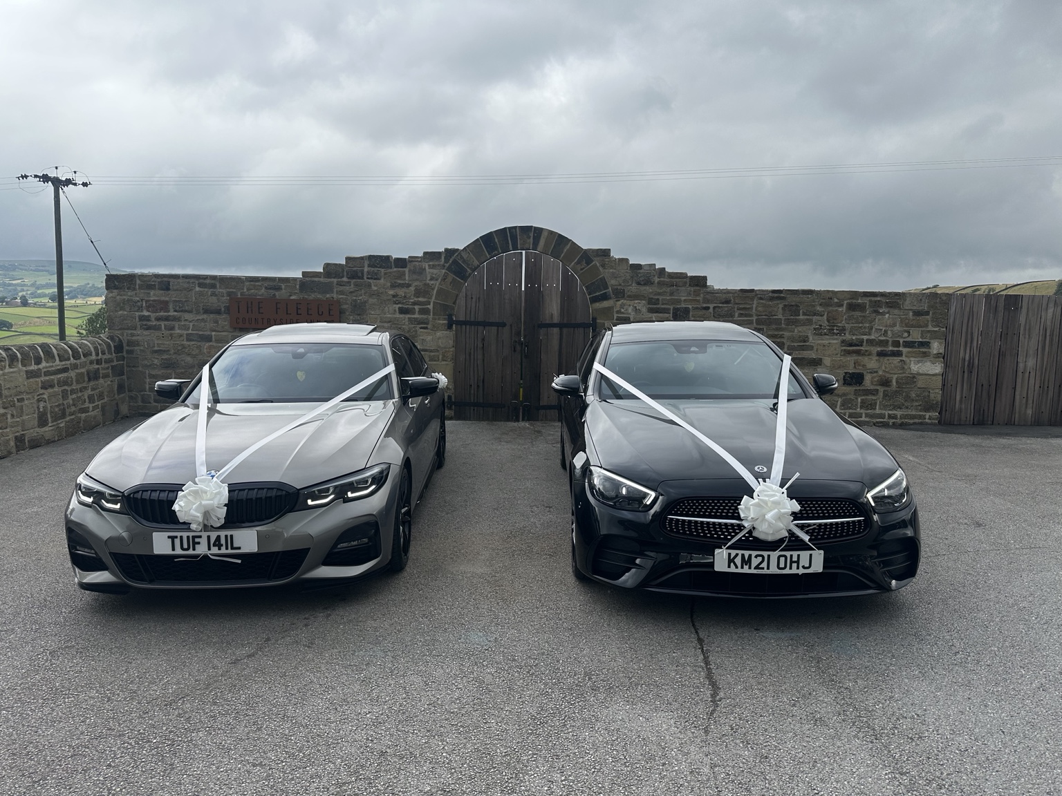 Woods Taxis wedding cars dressed with white ribbons